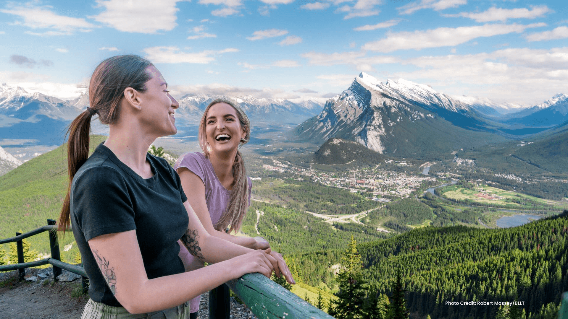 Two women looking out at the Town of Banff from Mt Norquay. Photo courtesy of BLLT.